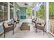 Screened-in porch offers outdoor living space with comfortable seating and views of the surrounding landscape at 103 Pigeon Forge Ct., Murrells Inlet, SC 29576