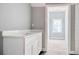 Bathroom with a white vanity, quartz countertop, tiled floors, and natural light at 105 Michau Rd., Georgetown, SC 29440