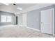 Unfinished bedroom with natural light, neutral paint, skylight, and two entry doors, perfect for customization at 105 Michau Rd., Georgetown, SC 29440