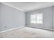 Bright, spacious room featuring large window, neutral wall color, and white trim, offering a serene ambiance at 105 Michau Rd., Georgetown, SC 29440
