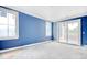 Well-lit bedroom with large windows and sliding glass door leading to the outdoors at 105 Michau Rd., Georgetown, SC 29440