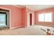 Bedroom painted in pastel pink with white trim, featuring large window providing ample natural light at 105 Michau Rd., Georgetown, SC 29440