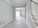 Bright entryway with staircase, crown molding and open access to adjacent rooms at 105 Michau Rd., Georgetown, SC 29440