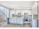 Spacious kitchen with white cabinets, blue island and ample counter space at 105 Michau Rd., Georgetown, SC 29440