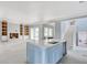 Open-concept kitchen with island, flowing into living area with fireplace and built-ins at 105 Michau Rd., Georgetown, SC 29440