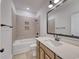 Bathroom with neutral tile shower and tub combination, light wood vanity, and modern fixtures at 1079 Laconic Dr., Myrtle Beach, SC 29588