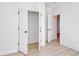 Light bedroom with closet featuring double doors and view to archway; perfect for customization at 1079 Laconic Dr., Myrtle Beach, SC 29588