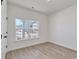 Bright bedroom with wood-look floors and a large window providing lots of natural light and outdoor views at 1079 Laconic Dr., Myrtle Beach, SC 29588