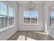 Bright dining room with light wood floors and three large windows at 1079 Laconic Dr., Myrtle Beach, SC 29588