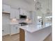 Bright kitchen features a large island with white countertops and stainless steel appliances at 1079 Laconic Dr., Myrtle Beach, SC 29588