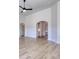 Spacious living room featuring an arched doorway and light wood floors at 1079 Laconic Dr., Myrtle Beach, SC 29588