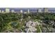 Aerial view of a Primary-planned community with tennis courts, pools, and manicured lawns near the ocean at 108 Westhill Circle # 7-E, Myrtle Beach, SC 29572