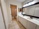 Bright bathroom features a double sink vanity, framed mirror, and shower at 108 Westhill Circle # 7-E, Myrtle Beach, SC 29572