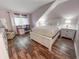 Bedroom with angled ceilings featuring a queen bed, wood floors, workstation, and accent lighting at 108 Westhill Circle # 7-E, Myrtle Beach, SC 29572