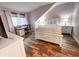 Bedroom with an angled ceiling, hardwood flooring, and a queen bed with white bedding at 108 Westhill Circle # 7-E, Myrtle Beach, SC 29572