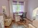 Bedroom showcasing desk workstation, office chair, wood floors, and abundant natural light from the window at 108 Westhill Circle # 7-E, Myrtle Beach, SC 29572
