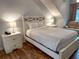 Bright bedroom features a bed, wood floors, side tables with lamps, and a sofa at 108 Westhill Circle # 7-E, Myrtle Beach, SC 29572