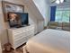 Bedroom features a dresser, TV, recliner chair, blue curtains and luxury vinyl plank flooring at 108 Westhill Circle # 7-E, Myrtle Beach, SC 29572