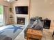 Coastal-themed living room showcasing a fireplace, and access to the outdoor balcony at 108 Westhill Circle # 7-E, Myrtle Beach, SC 29572