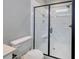 Modern bathroom with glass-enclosed shower and white tile at 1083 Laconic Dr., Myrtle Beach, SC 29588
