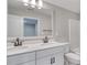 Bathroom features a double sink vanity with modern fixtures, white cabinets, and a toilet at 1083 Laconic Dr., Myrtle Beach, SC 29588