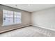Well-lit bedroom features neutral-toned walls, carpeted floors, and a large window at 1083 Laconic Dr., Myrtle Beach, SC 29588