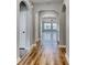 Hallway featuring hardwood floors, white trim, arched doorways, and views into the living area at 1083 Laconic Dr., Myrtle Beach, SC 29588