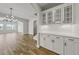 The kitchen features white cabinets, subway tile backsplash, stainless steel appliances, and hardwood floors at 1083 Laconic Dr., Myrtle Beach, SC 29588