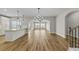 Spacious open-concept floor plan featuring hardwood floors, abundant natural light, and views of the kitchen at 1083 Laconic Dr., Myrtle Beach, SC 29588