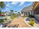 Charming backyard seating area with a stone path, fountain, and well manicured landscaping at 1145 Captain Hooks Way, North Myrtle Beach, SC 29582