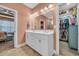 Bathroom featuring a double sink vanity and a walk-in closet at 1145 Captain Hooks Way, North Myrtle Beach, SC 29582