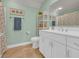 Bathroom featuring a vanity and toilet in front of a light green wall at 1145 Captain Hooks Way, North Myrtle Beach, SC 29582