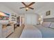Bright bedroom with ceiling fan, dresser, and closet, offering a comfortable space at 1145 Captain Hooks Way, North Myrtle Beach, SC 29582