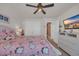Bedroom with a ceiling fan, closet doors, and a doorway to another room at 1145 Captain Hooks Way, North Myrtle Beach, SC 29582
