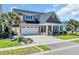 Charming home with a well-manicured lawn, two car garage, and covered front porch at 1145 Captain Hooks Way, North Myrtle Beach, SC 29582