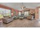 Comfortable living room featuring two chairs, large sofa, and bright natural light at 1145 Captain Hooks Way, North Myrtle Beach, SC 29582