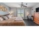 Comfortable bedroom featuring a ceiling fan, a comfortable bed and bedside table with a reading lamp at 117 Butkus Dr. # 6, Myrtle Beach, SC 29588