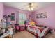 This colorful bedroom is well-lit and has a window and fun decorations at 117 Butkus Dr. # 6, Myrtle Beach, SC 29588