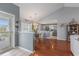 This view of the dining area shows the access to the kitchen and the front entryway at 117 Butkus Dr. # 6, Myrtle Beach, SC 29588