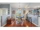 This open-concept dining area offers natural light and an attractive chandelier at 117 Butkus Dr. # 6, Myrtle Beach, SC 29588