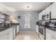 The kitchen features stainless steel appliances, granite countertops and neutral paint at 117 Butkus Dr. # 6, Myrtle Beach, SC 29588