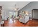 The living room has a vaulted ceiling, a ceiling fan, and hardwood floors at 117 Butkus Dr. # 6, Myrtle Beach, SC 29588