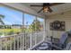 This screened-in porch has a ceiling fan, with a view of the community and the lake at 117 Butkus Dr. # 6, Myrtle Beach, SC 29588