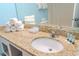 Bathroom vanity with granite countertop, sink, mirror, and fresh towels at 1207 Ocean Blvd. S # 20802, Myrtle Beach, SC 29577
