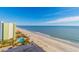 Stunning beachfront view of the ocean, white sandy beach, pool area and palm trees at this Myrtle Beach resort at 1207 Ocean Blvd. S # 20802, Myrtle Beach, SC 29577