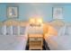 Comfortable bedroom with two beds and decorative artwork creates a cozy ambiance at 1207 Ocean Blvd. S # 20802, Myrtle Beach, SC 29577