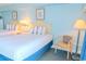 Bright bedroom featuring two queen beds, a chair, and coastal decor creating a welcoming atmosphere at 1207 Ocean Blvd. S # 20802, Myrtle Beach, SC 29577