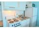 Well-equipped kitchenette with stovetop, microwave, sink and refrigerator, perfect for cooking at 1207 Ocean Blvd. S # 20802, Myrtle Beach, SC 29577