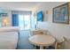 Comfortable suite provides ocean views, dining table, and two beds for a relaxed stay at 1207 Ocean Blvd. S # 20802, Myrtle Beach, SC 29577