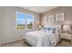 Comfortable bedroom with a large window and elegant bedside decor at 128 Dagger Ct., Myrtle Beach, SC 29588